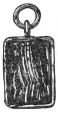 carved rectangular charm